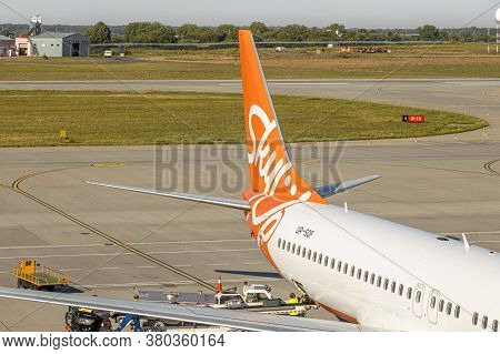 Lviv, Ukraine - 09 Aug 2020: Sky Up Charter Plane Unloads Baggage At The Lviv Lwo Danylo Halytski Na