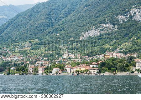 Waterfront of Mezzegra Municipality on Lake Como. Lombardy. Italy. Panorama with Mountains and Forest.