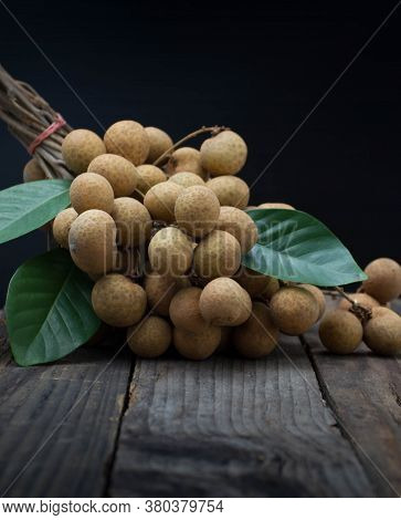 Lots Of Longan Fruit On The Wooden Table.
