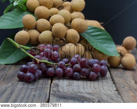 Lots Of Longan Fruit On The Wooden Table.