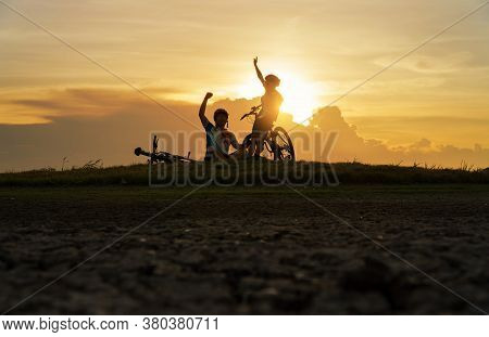 Young Couple In Love Fun And Happy Riding Mountain Bike After Covid-19 Coronavirus Outbreak. End Of 