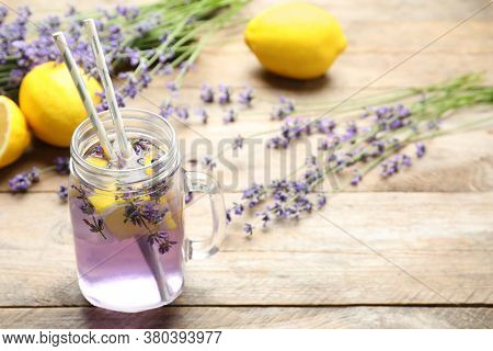 Fresh Delicious Lemonade With Lavender In Masson Jar On Wooden Table. Space For Text