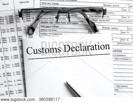 Paper With Text Customs Declaration On A Financial Tables With Glasses