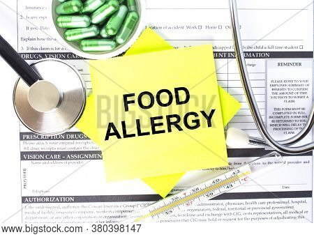 Text Food Allergy In A Notebook On Medical Forms With A Phonendoscope And Green Pills