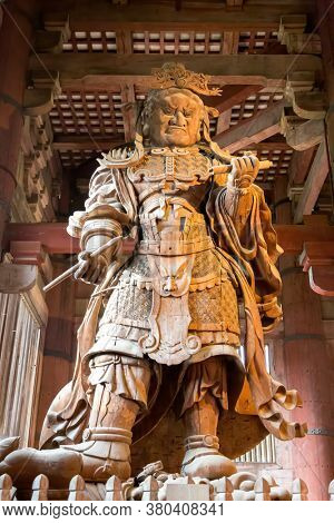 Nara, Japan - 13 June 2016: Komokuten, one of the pair of guardians of the four directions, an ancient wooden sculpture at the Todaiji Temple, Nara, Japan. Komokuten guards the west.
