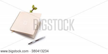 Green Tree Branches, Notebook And Pen Isolated On White Background. Negative Space Composition