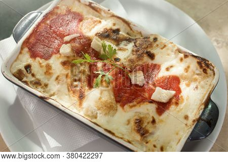 Baked Pencake With Cheese Sauce Or Lasagne Italian Food In Restaurant.