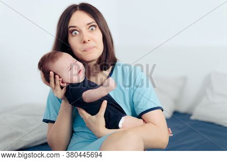 Stressed Mom Holding Crying Baby Feeling Clueless