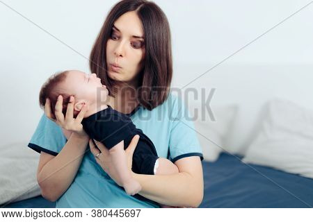 Stressed Mom Holding Crying Baby Feeling Clueless