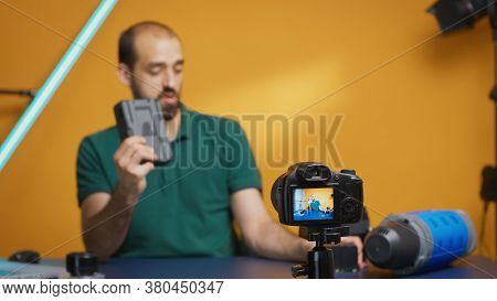 Vlogger Recording Review Of Professional Accumulators For Videographers Gear. Modern V-lock Type Tec