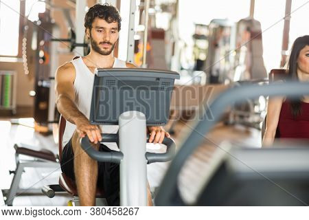 Group of people working out on a stationary bike