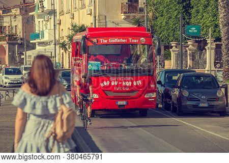 Giardini Naxos, Sicily, Italy - September 26, 2019: Red Tourist Bus Hop On Hop Off Godfather Tour Is