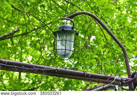 Street Lighting Hangs Over Barbed Wire. Genaral Plan. Color