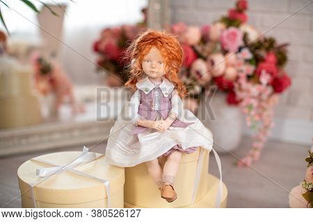 An Interior Design Doll With A Human Face , Made By Hand From Textiles, In A Retro Style , Sits On G