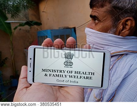 District Katni, India - 28 May 2020: An Indian Village Man Holding Smart Phone With Displaying Minis