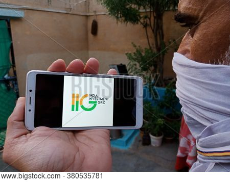 District Katni, India - 28 May 2020: An Indian Village Man Holding Smart Phone With Displaying India