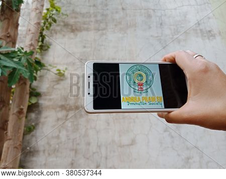 District Katni, India - 28 May 2020: An Indian Lady Holding Smart Phone With Displaying Andhra Prade