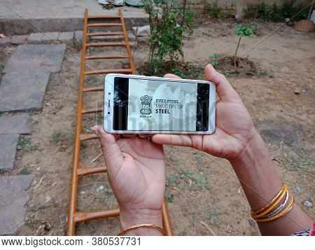 District Katni, India - 28 May 2020: An Indian Lady Holding Smart Phone With Displaying Ministry Of 