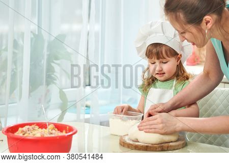 Happy Loving Family Are Preparing Bakery Together. Mom Teaching Child How To Cook Cooking Pie And Ha