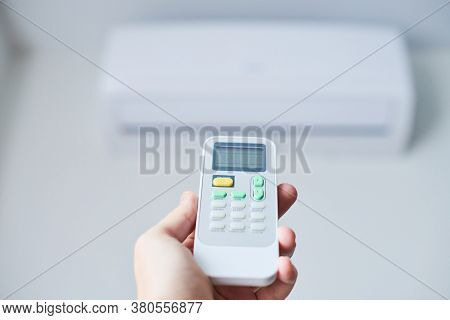 Remote Control For Air Conditioner In Hand. Room Condition Remote Control. Air Temperature Switch Fo