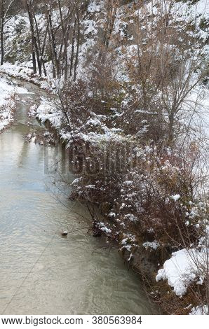 Gallego River with its snow-covered banks. Sabinanigo. Huesca. Aragon. Spain.
