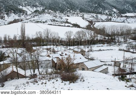 Houses and rural landscape covered with snow. Sabinanigo Alto. Huesca. Aragon. Spain.