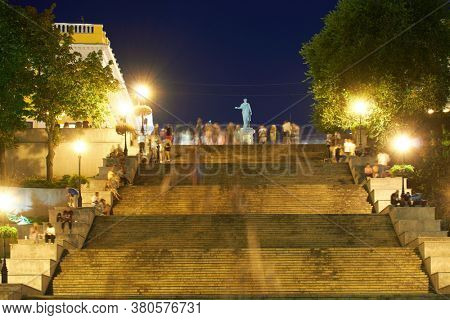 night street view of Odessa city, Ukraine, Potemkin stairs near the Primorskiy boulevard, walking people