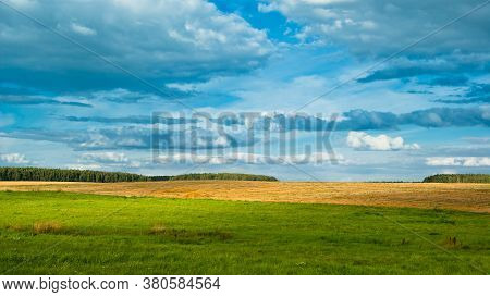 Beautiful Tranquil Rural Scene Of Landscape With Cloudy Blue Sky In Belarus.