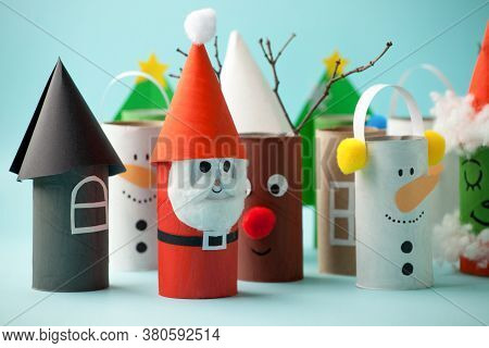 Paper Toy Santa, Snowman, Grinch For Xmas Party. Easy Crafts For Kids On Blue Background, Copy Space