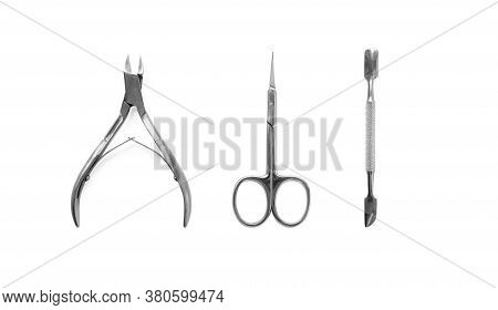 Manicure And Pedicure Nail Care Tools Set Isolated On White Background, Top View. Cuticle Pusher, Cu