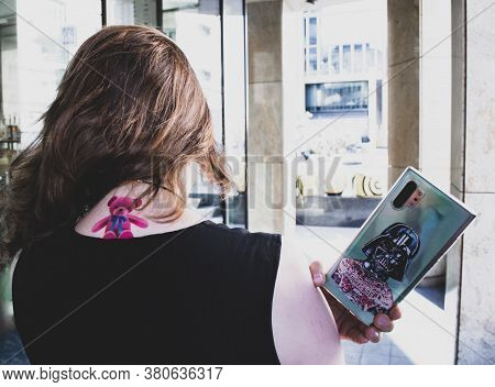Moscow, Russia, July 2020: A View From The Back Of A Girl With Wind In Her Hair And A Pink Teddy Bea
