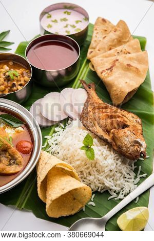 Indian Fish Platter Or Seafood Thali Served In A Steel Plate Or Over Banana Leaf