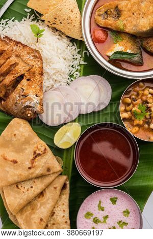 Indian Fish Platter Or Seafood Thali Served In A Steel Plate Or Over Banana Leaf