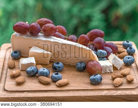 Set Of Elite Delicious Food, Brie Cheese, Grape, Migdal And Blueberry