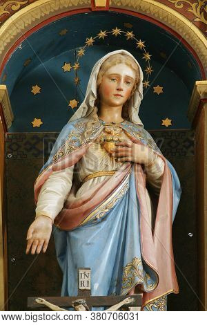 ROZGA, CROATIA - SEPTEMBER 15, 2012: Altar of the Immaculate Heart of Mary at St. Anne Church in Rozga, Croatia