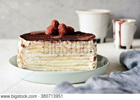 Crepe Cake Made Of Thin Crepe With Butter Cream, Cocoa, Chocolate,freeze-dried Strawberries. Delicio