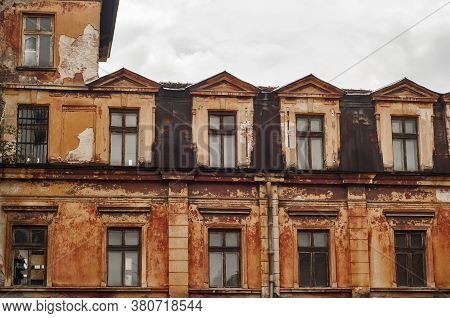 Old Vintage Dacayed Neglected Building Facade Closeup In Cloudy Day