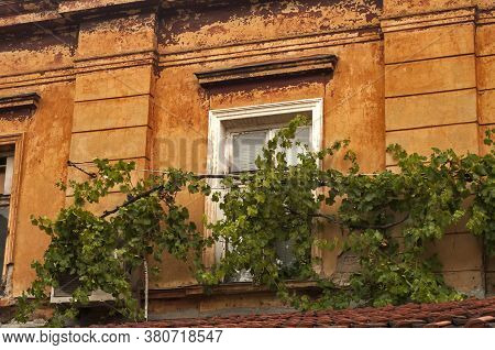 Old Vintage Dacayed Neglected Building Facade Closeup In Cloudy Day