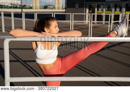 Gymnast Woman In Pink Leggings Doing Stretches For Legs, Splits With Yoga Asana, Practicing Pilates,