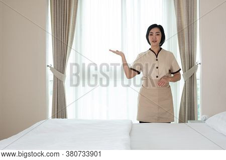 Young Asia Chambermaid In The Hotel Room Her Lool At Camera