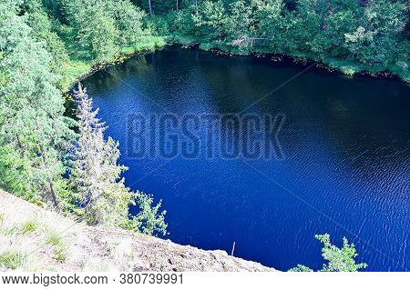Overlooking A Little Lake From A Mountain In Sweden