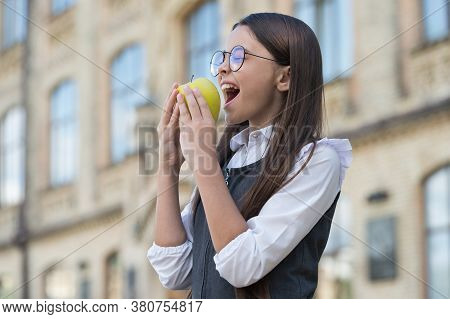 Healthy Eating Keeps The Heart Beating. Happy Child Bite Apple Outdoors. School Snack. Health Educat
