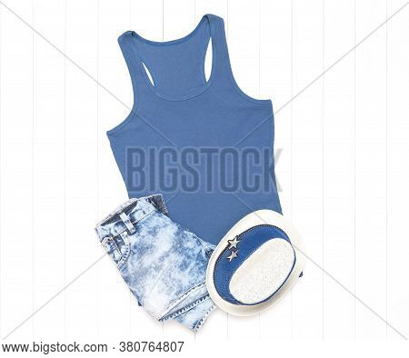 Tank Top In Iris Color With Shorts And A Summer Hat On A Light Wooden Background - Tank Top Mockup F