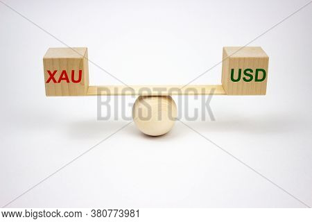 Xauusd Concept, Inscriptions On Wooden Cubes On Wooden Scales With The Names Of Trading Instruments 