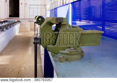 Green Steel Vice In The Metalworking Workshop