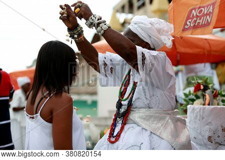 Salvador, Bahia / Brazil - January 25, 2015: Candomble Fans Are Seen During A Bath With Popcorn In T
