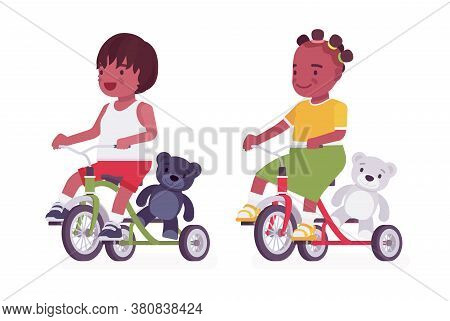 Toddler Children, Black Little Boy And Girl Enjoying Riding Tricycle. Cute Sweet Happy Healthy Baby 