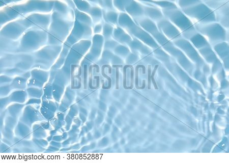 Blurred Transparent Blue Colored Clear Calm Water Surface Texture With Splashes And Bubbles. Trendy 