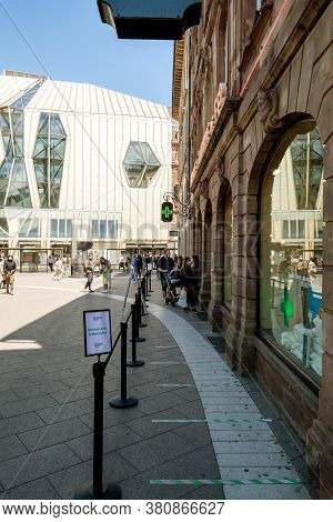 Strasbourg, France - May 30, 2020: Large Queue To Pharmacie De Lhomme De Fer In Central Strasbourg D