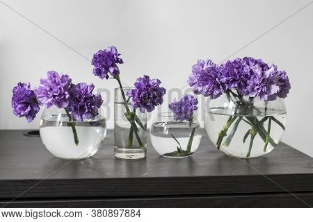 Bridal Bouquets Of Lilac Carnations In A Four Round Glass Vases Different Sizes As Table Decoration